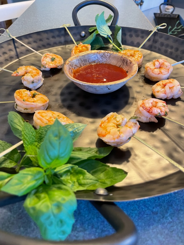 grilled shrimp, mango cocktail sauce, hammered metal platter, fresh geens garnish